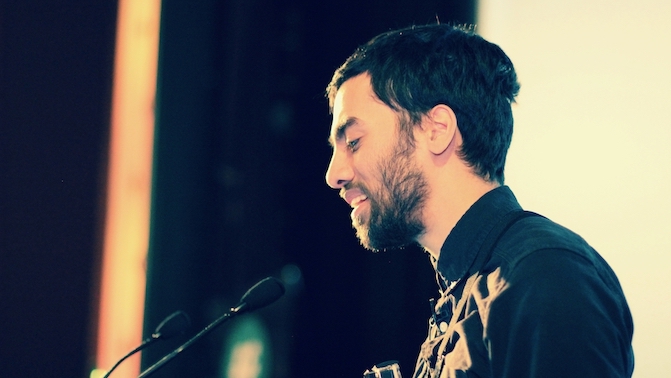 Umar giving a conference talk